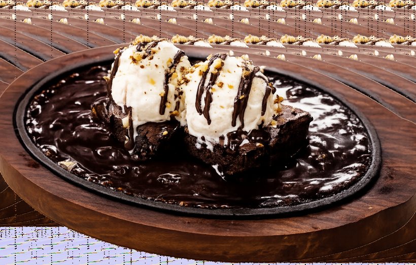 Hot brownie with ice cream served in a sizzler